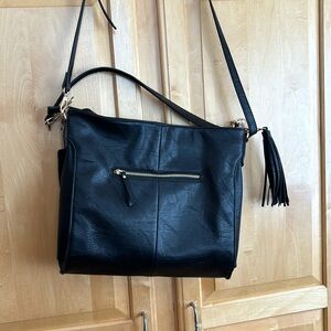 Woman’s leather handbag. Double straps.    outside pocket/one inside pocket